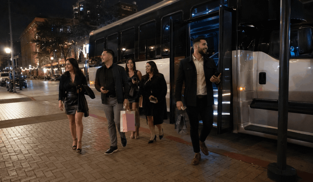 party bus dropping off a birthday group near a nightlife area in fort worth