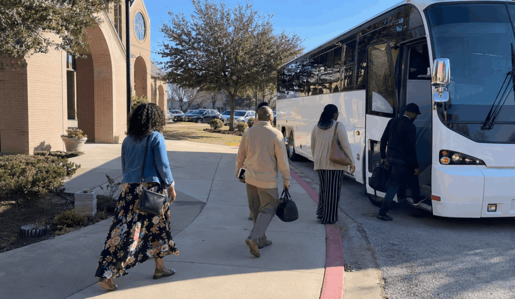 church group boarding a charter bus outside a fort worth church for a group trip