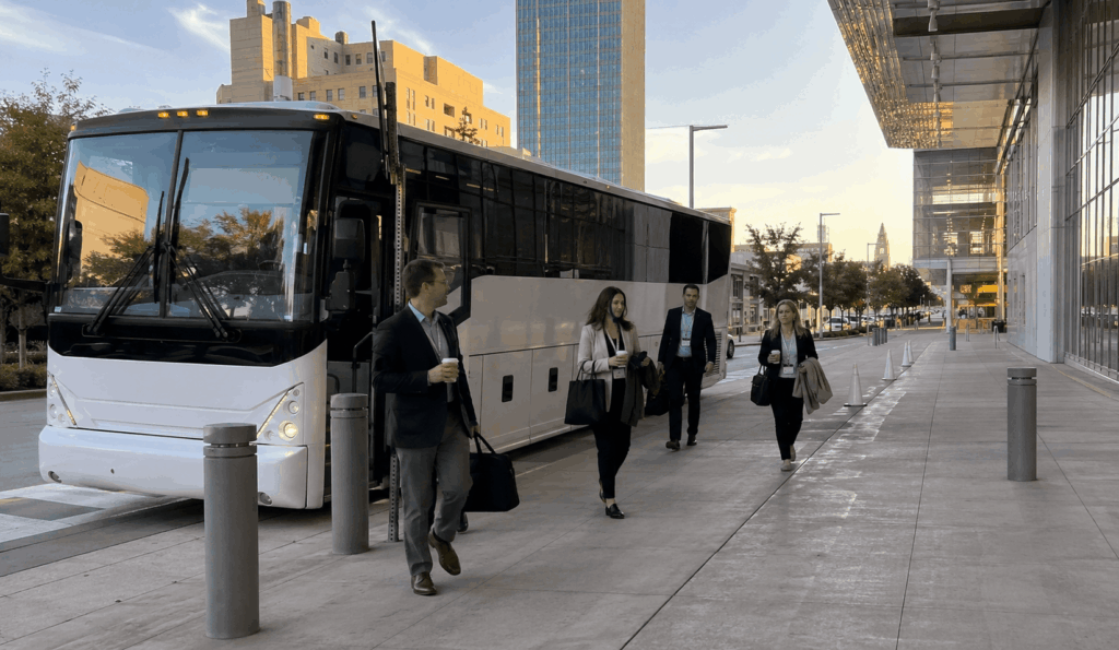 charter bus dropping off corporate event attendees near the fort worth convention center in downtown fort worth