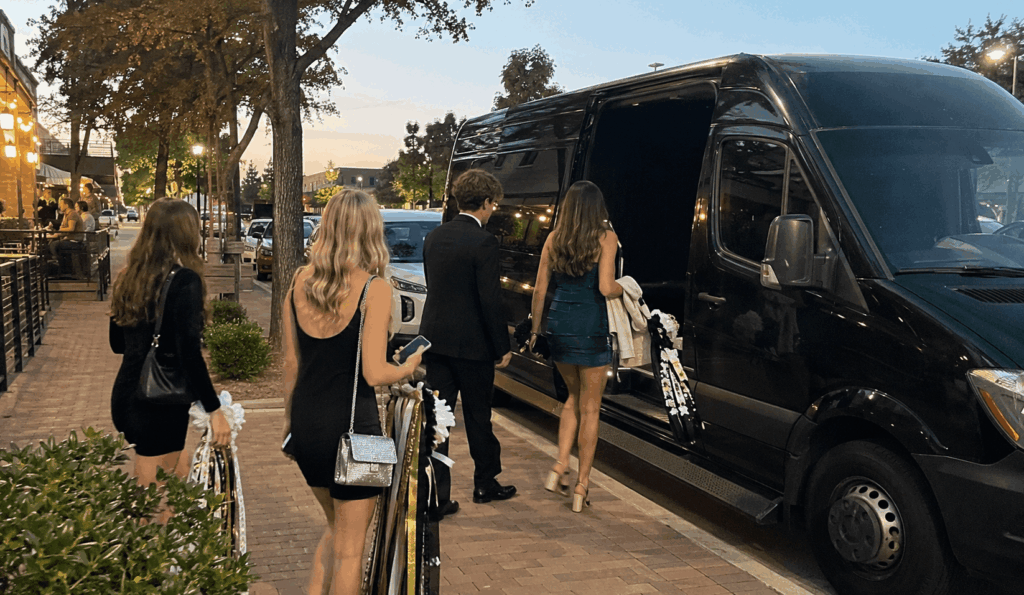 homecoming group walking from dinner to a limo in fort worth before the dance