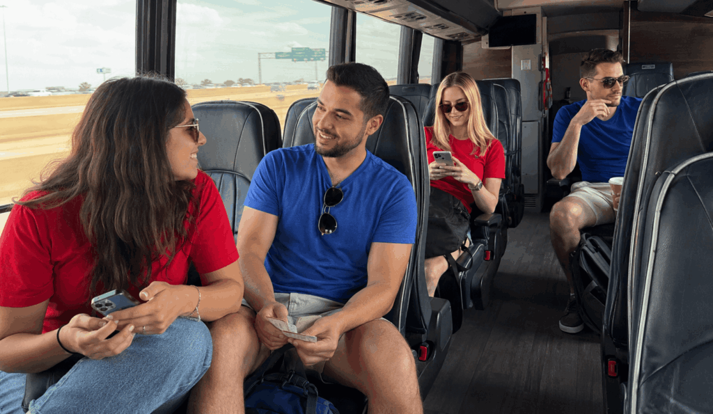 group of soccer fans riding a charter bus from fort worth to frisco for an fc dallas match