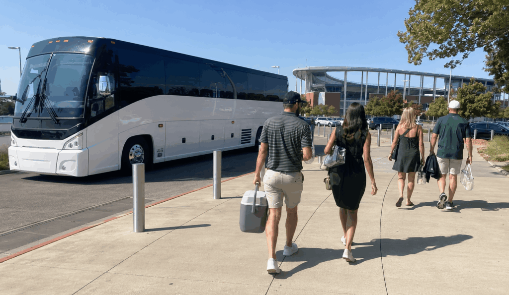 charter bus arriving near mclane stadium in waco for a baylor game day trip from fort worth