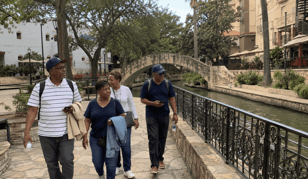 church group walking together near the San Antonio River Walk during a charter bus sightseeing trip