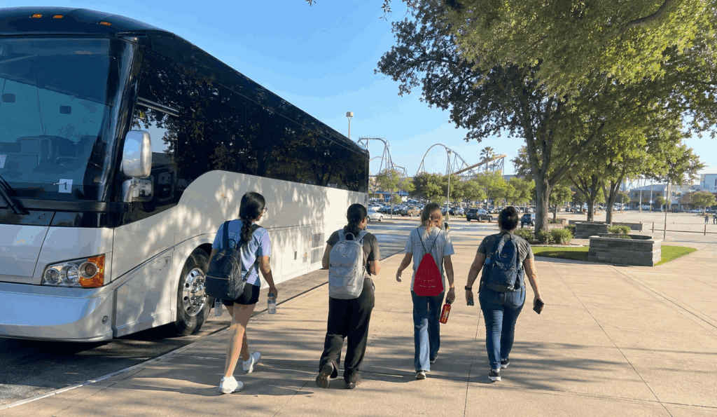 charter bus arriving with students for a six flags over texas school trip in arlington