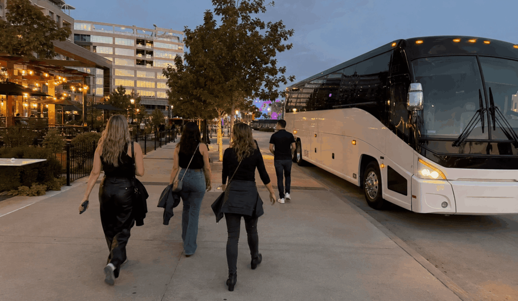 charter bus dropping off a group near toyota music factory in irving for a concert night from fort worth